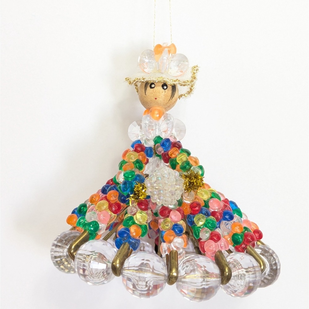 Vintage kitschy beaded safety pin doll colorful dress painted wood head ornament